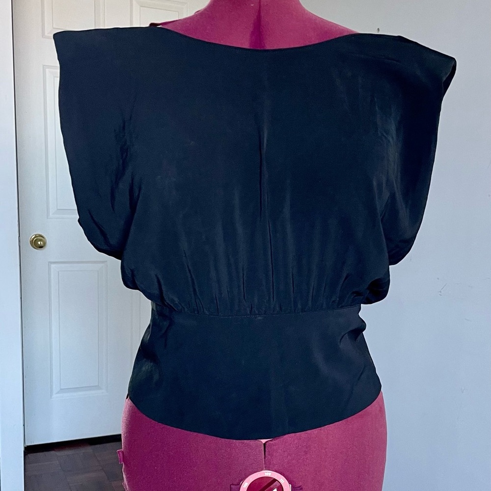 Naked Zebra - classy black top with shoulder pads, back slit and back zip